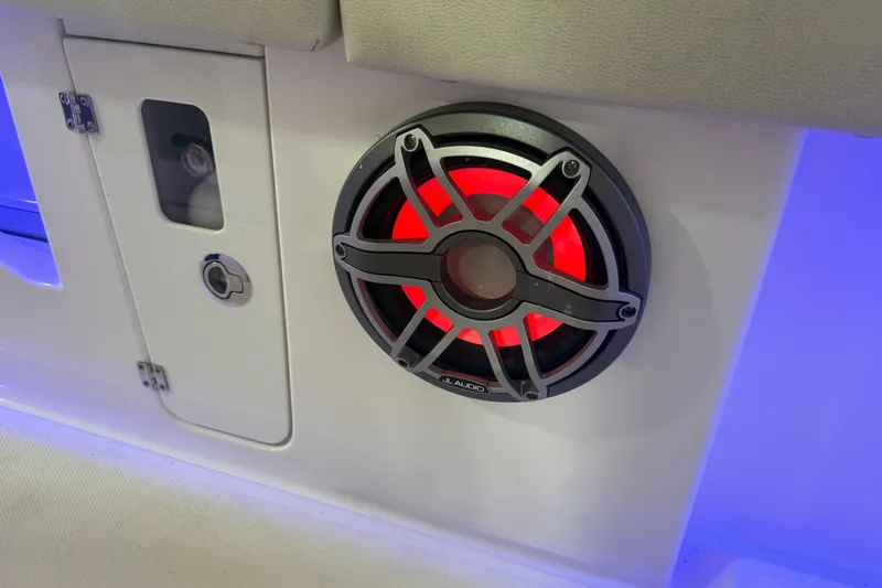 Slide: The Image of Red LED-lit speaker on 2024 Solace 30HCS boat interior. - 29