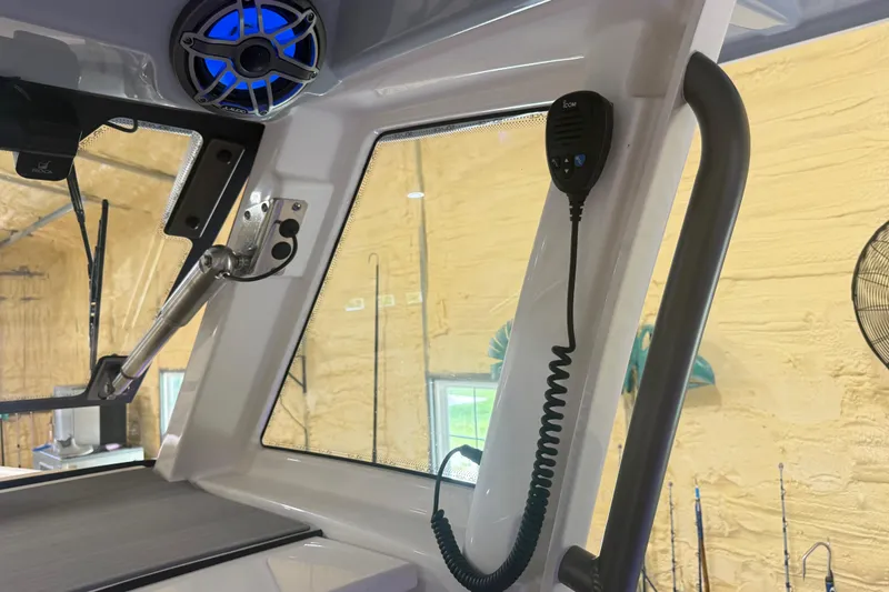 Slide: The Image of Interior of 2024 Solace 30HCS boat featuring speaker and communication device. - 50