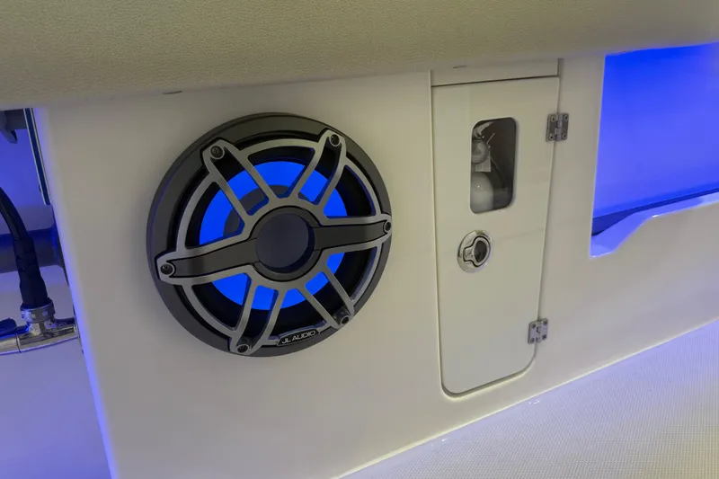 Slide: The Image of 2024 Solace 30HCS boat interior with JL Audio speaker and blue LED lighting. - 41