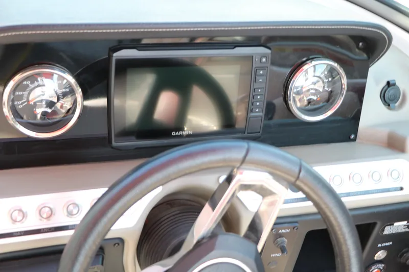 Slide: The Image of Dashboard of 2022 Crownline Eclipse E255 boat with Garmin display and gauges. - 35