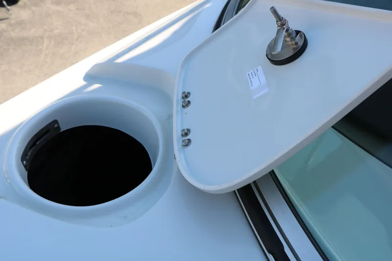 Slide: The Image of Open hatch on 2022 Crownline Eclipse E255 boat, showcasing storage compartment. - 50