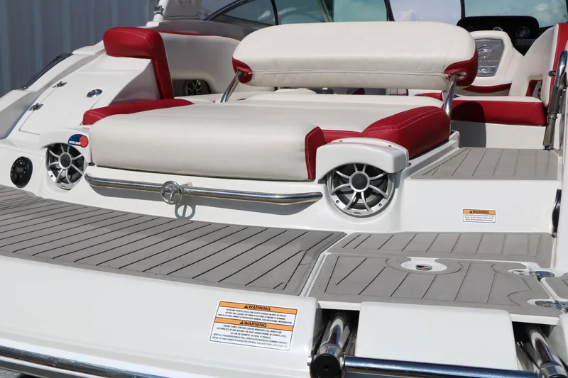 Slide: The Image of 2022 Crownline Eclipse E255 boat with red and white seating, showcasing modern design and speakers. - 10