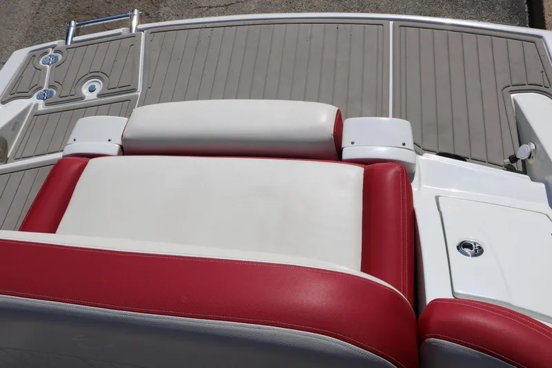 Slide: The Image of 2022 Crownline Eclipse E255 boat with red and white seating and swim platform. - 46