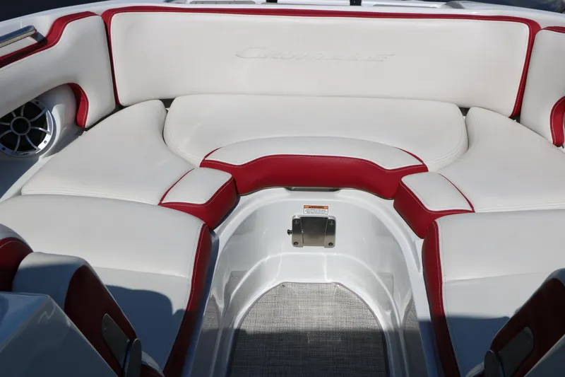 Slide: The Image of 2022 Crownline Eclipse E255 boat interior with white and red seating. - 30