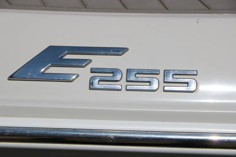 Slide: The Image of 2022 Crownline Eclipse E255 emblem on a white surface. - 9