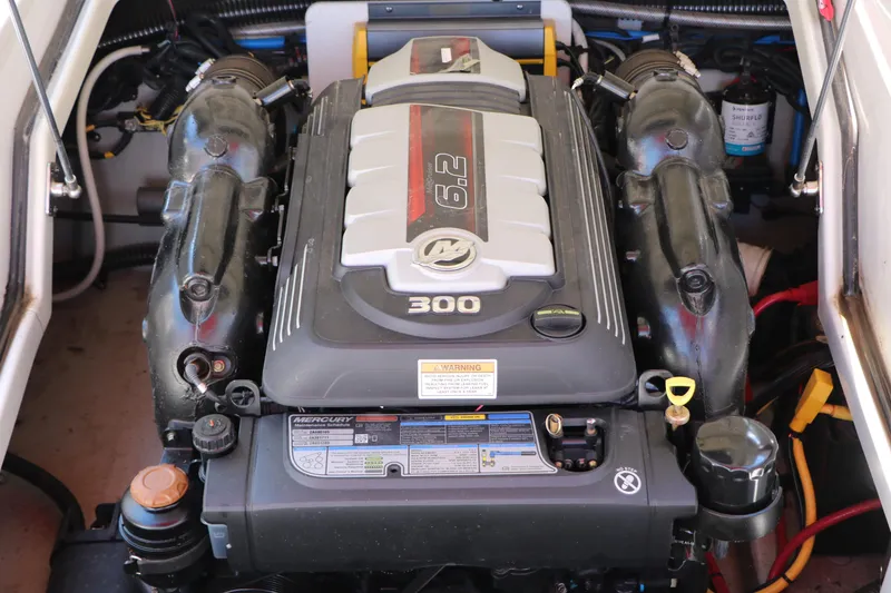 Slide: The Image of Engine compartment of 2022 Crownline Eclipse E255 boat, featuring a Mercury 6.2L engine. - 36