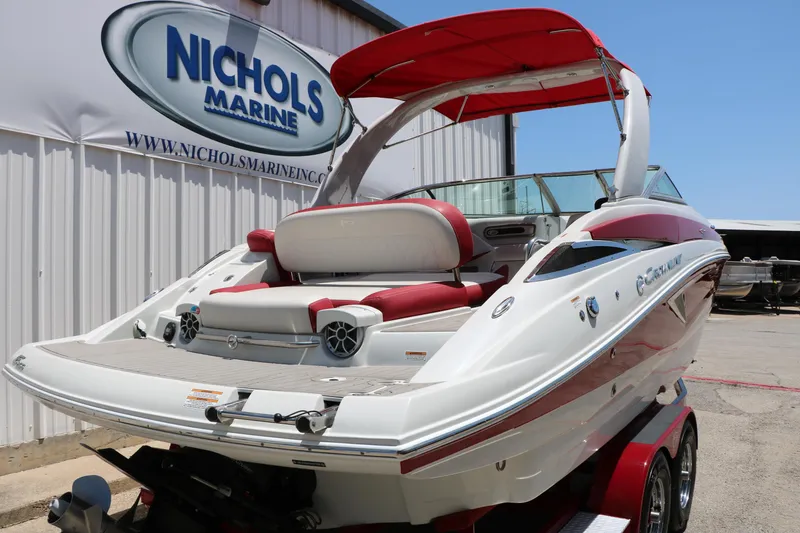 Slide: The Image of 2022 Crownline Eclipse E255 boat with red accents at Nichols Marine dealership. - 3