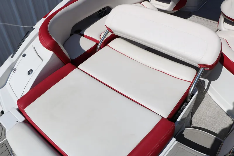 Slide: The Image of 2022 Crownline Eclipse E255 boat interior with red and white seating. - 20