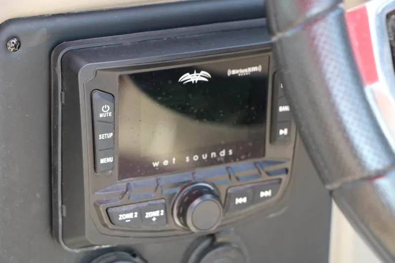 Slide: The Image of Wet Sounds audio system on 2022 Crownline Eclipse E255 boat dashboard. - 34