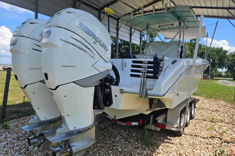Slide: The Image of 2003 Dakota 36 CC boat with twin Mercury Verado engines on a trailer. - 9