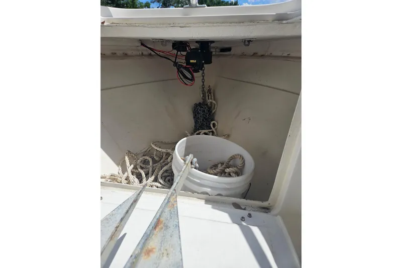 Slide: The Image of Anchor locker of 2003 Dakota 36 CC boat with ropes and chains. - 36