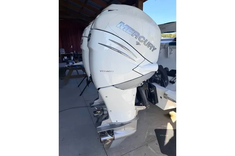 Slide: The Image of Outboard motor on a 2003 Dakota 36 CC boat, featuring Mercury Verado engine. - 16