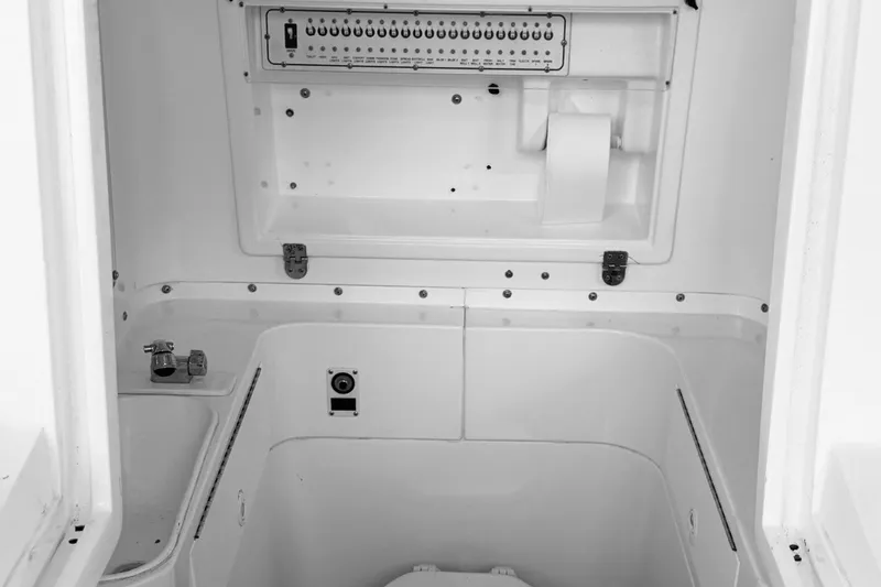 Slide: The Image of Interior view of a 1998 Dakota 36 CC boat's control panel and storage compartment. - 40