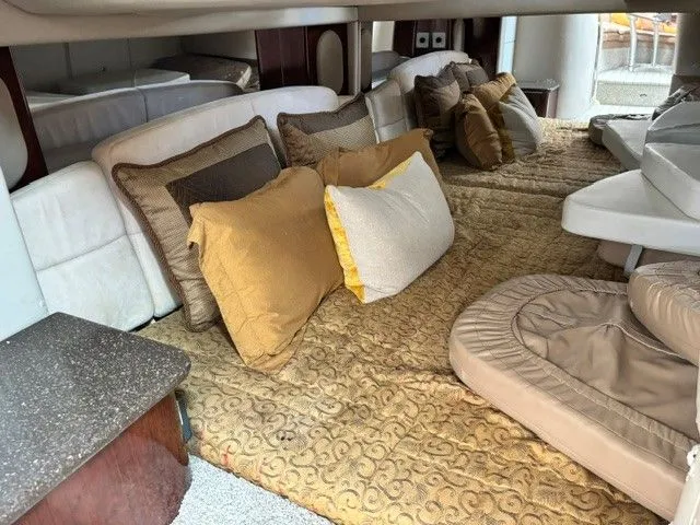 Slide: The Image of The image shows the interior of a 2003 Formula 400 Super Sport with cozy cushions and upholstery. - 10