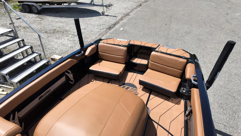 Slide: The Image of The image shows the interior of a 2025 Malibu TXi with brown leather seating. - 10