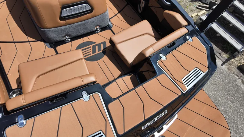 Slide: The Image of The image shows the interior of a 2025 Malibu TXi with brown upholstery and stylish design. - 7