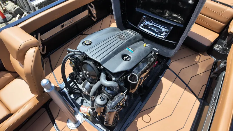 Slide: The Image of The image shows the engine compartment of a 2025 Malibu TXi with a powerful engine. - 18