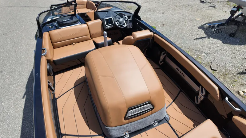 Slide: The Image of The image shows the interior of a 2025 Malibu TXi with brown leather seating. - 8