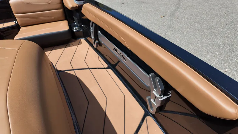 Slide: The Image of The image shows the interior of a 2025 Malibu TXi with brown leather seats and sleek details. - 16