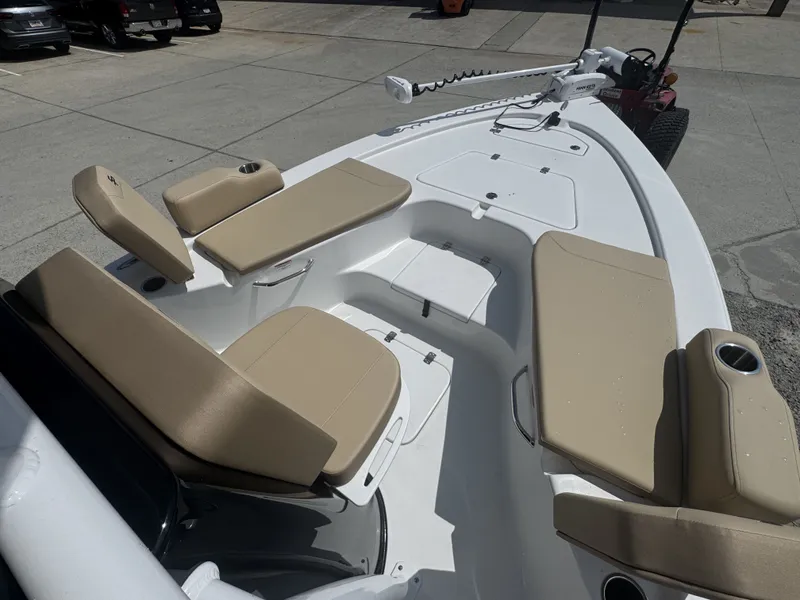 Slide: The Image of The image shows the deck of a Sea Pro 230 DLX boat with beige cushions. - 5