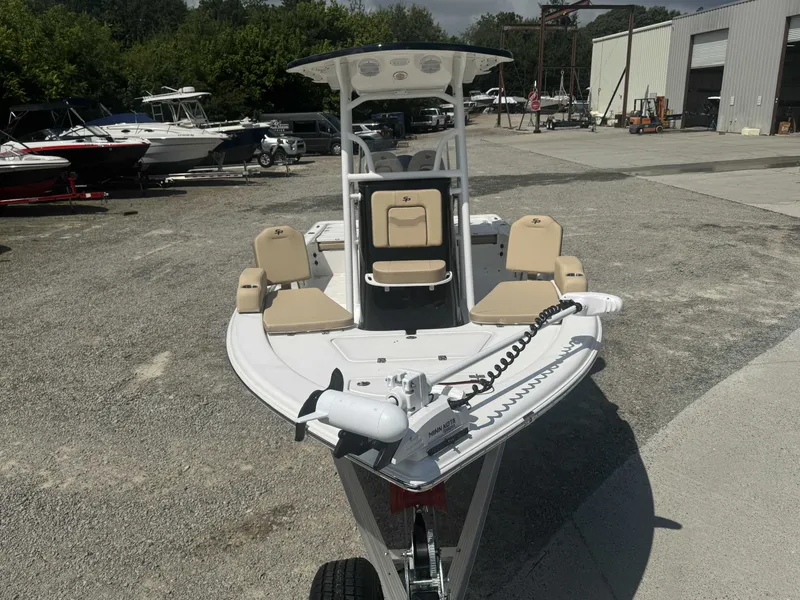 Slide: The Image of A 2027 Sea Pro 230 DLX boat on a trailer in an outdoor area. - 12