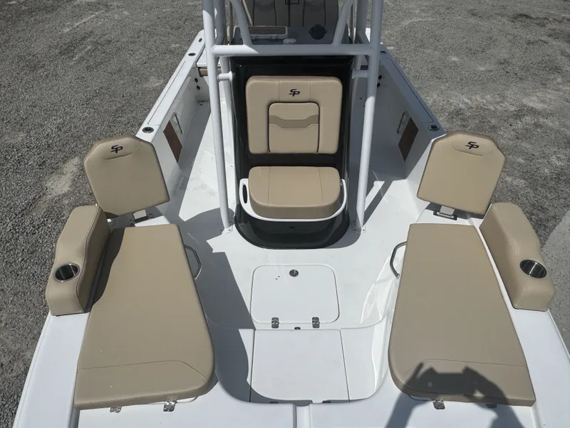 Slide: The Image of The image shows the cockpit of a Sea Pro 230 DLX boat with beige seating. - 11