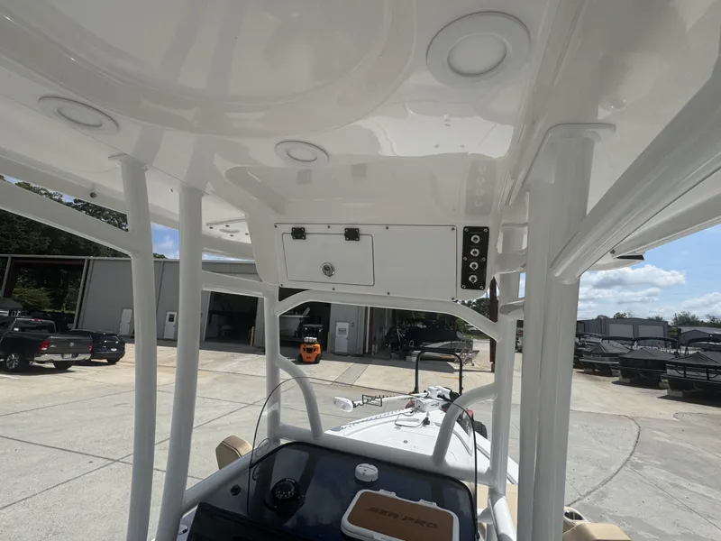 Slide: The Image of The image shows the cockpit of a 2027 Sea Pro 230 DLX boat with a modern helm. - 9