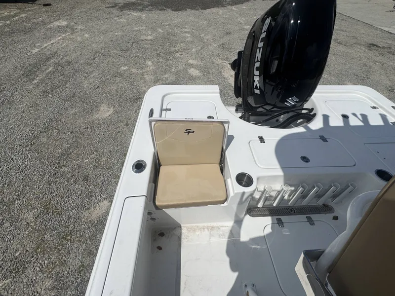 Slide: The Image of The image shows the stern of a Sea Pro 230 DLX boat with a Suzuki outboard motor. - 7