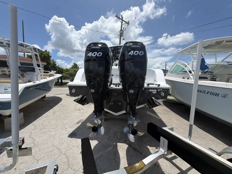 Slide: The Image of A 2021 Sportsman Open 322 Center Console boat with twin 400 HP outboard engines. - 6
