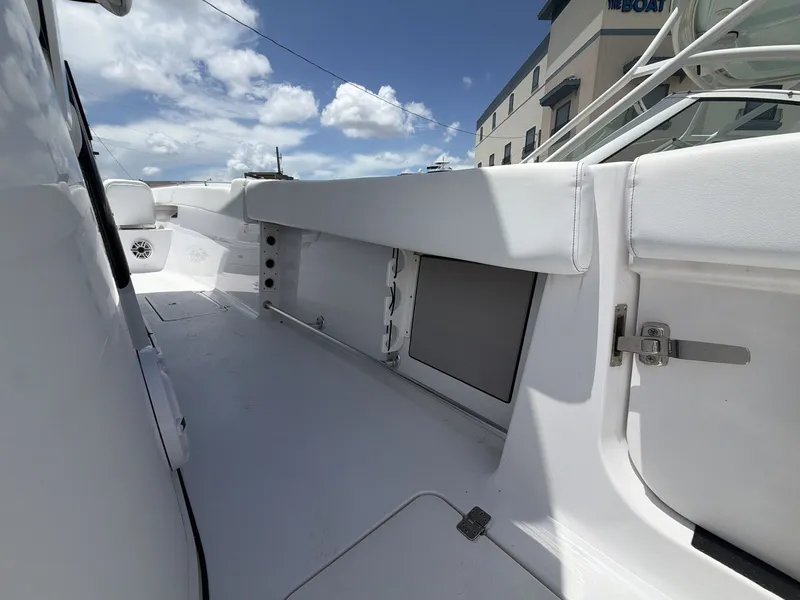 Slide: The Image of The image shows the deck of a 2021 Sportsman Open 322 Center Console boat. - 14