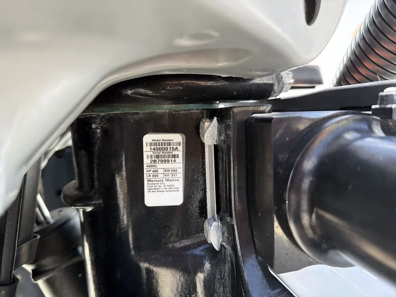 Slide: The Image of Close-up of a boat outboard motor with a label showing technical details. - 21