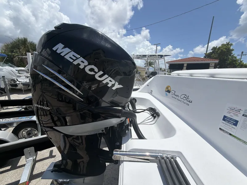 Slide: The Image of A Mercury outboard motor is mounted on a 2021 Sportsman Open 322 Center Console boat. - 17