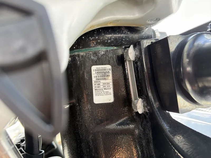 Slide: The Image of Close-up of a boat outboard motor with a label showing technical details. - 20