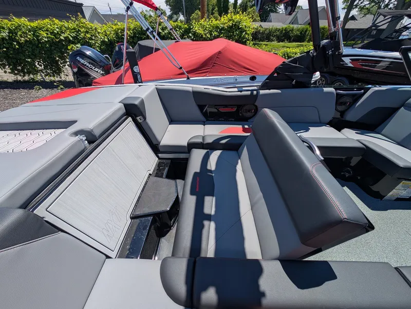 Slide: The Image of The image shows the interior of a 2025 MasterCraft NXT 23 boat with gray and black seating. - 17