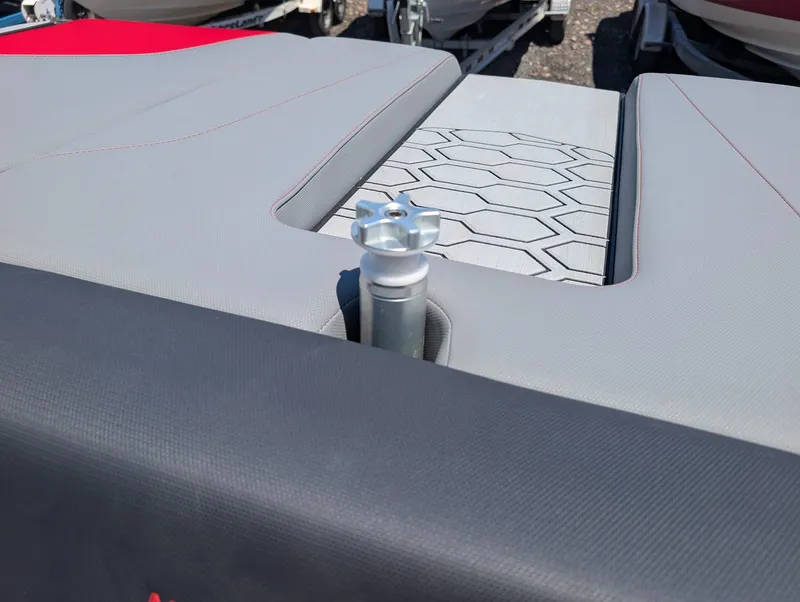 Slide: The Image of The image shows the stern of a MasterCraft NXT 23 boat with gray upholstery and a silver handle. - 15