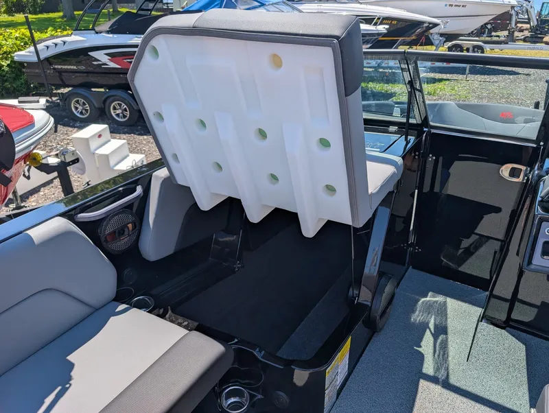 Slide: The Image of The image shows the interior of a 2025 MasterCraft NXT 23 boat with modern seating. - 11