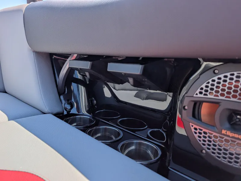 Slide: The Image of The 2025 MasterCraft NXT 23 features a sleek interior with cup holders and a speaker. - 13