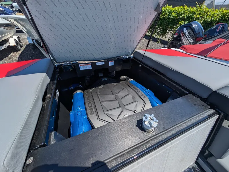 Slide: The Image of The engine compartment of a 2025 MasterCraft NXT 23 with a powerful engine. - 18