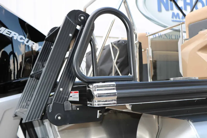 Slide: The Image of A modern boat ladder with black steps and stainless steel railing, integrated into a sleek design. - 17