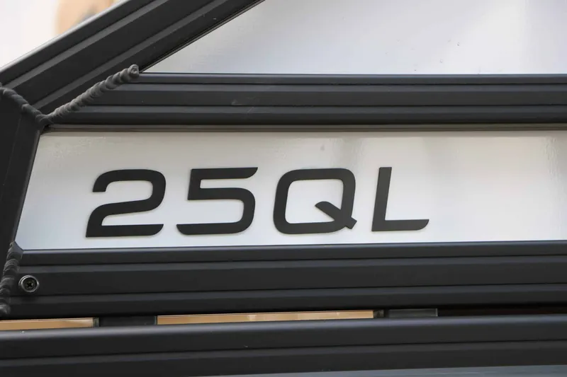Slide: The Image of Close-up of the "25QL" lettering on a boat. - 11