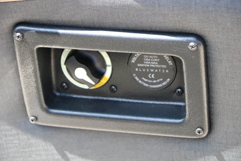 Slide: The Image of Close-up of an electrical outlet with 12V auto and 15A max current. Black cover. - 39