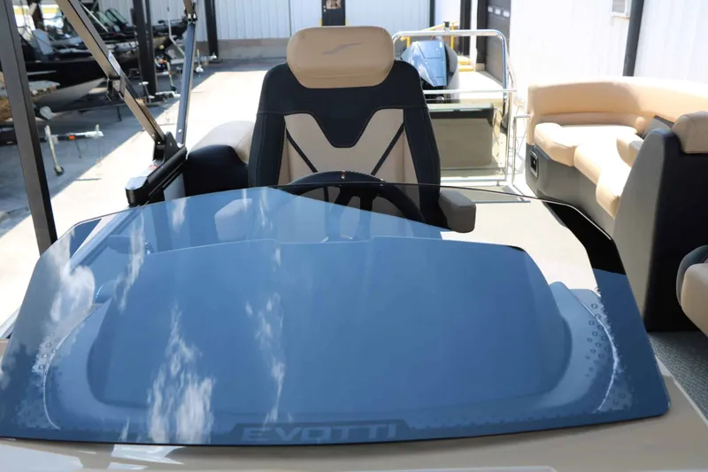 Slide: The Image of The image shows the cockpit of a 2026 Evotti 725 QL boat with a modern steering wheel and blue windshield. - 47