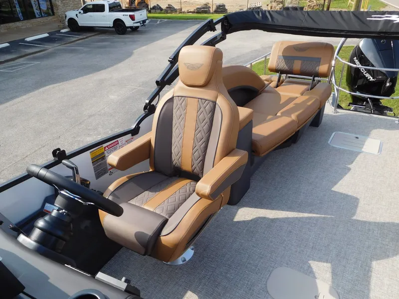 Slide: The Image of The image shows the cockpit of a 2026 Bennington 24 MSL with luxurious seating. - 10