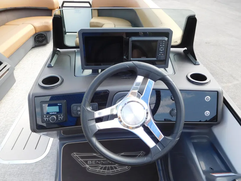 Slide: The Image of The image shows the cockpit of a 2026 Bennington 24 MSL with modern instruments and steering wheel. - 18