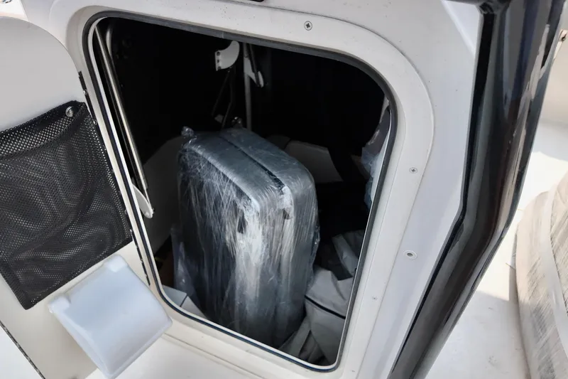 Slide: The Image of Storage compartment of 2027 Carolina Skiff 21 Ultra Elite boat, featuring interior details. - 4