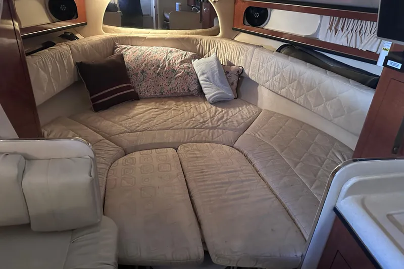 Slide: The Image of Interior cabin of a 2003 Sea Ray Sundancer 280 with cozy seating and cushions. - 20