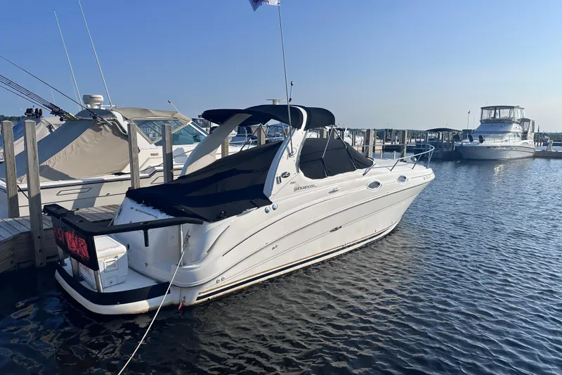 Slide: The Image of 2003 Sea Ray Sundancer 280 docked at marina, clear sky, calm water. - 4