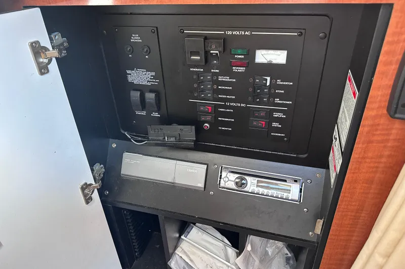 Slide: The Image of Electrical control panel inside a 2003 Sea Ray Sundancer 280 boat cabin. - 28