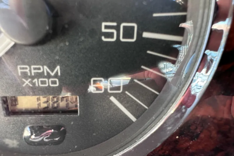 Slide: The Image of Close-up of a 2003 Sea Ray Sundancer 280 RPM gauge showing 1387 hours. - 24