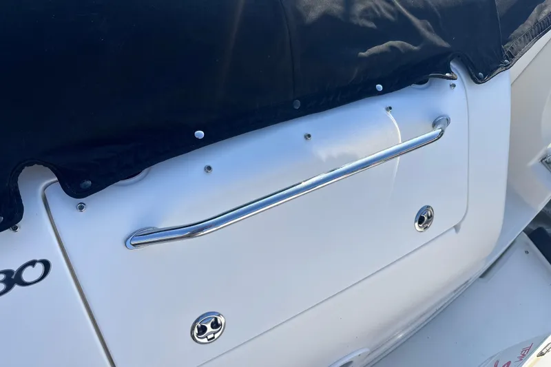 Slide: The Image of The image shows the stern of a 2003 Sea Ray Sundancer 280 with a black cover. - 9